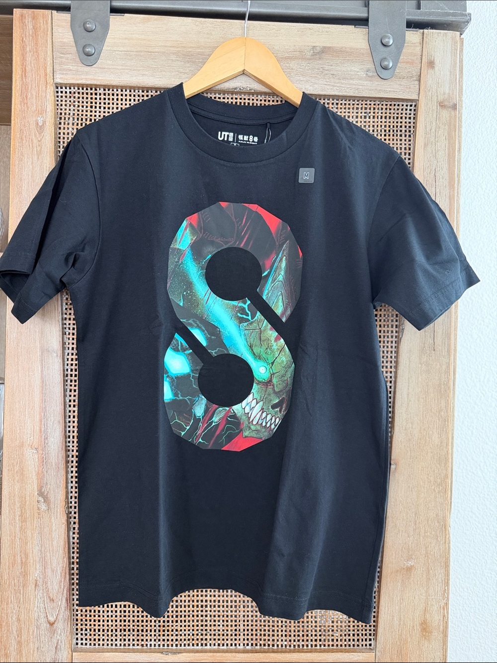 Uniqlo Kaiju No. 8 Black Graphic Tee with Teal and Red “8” Design